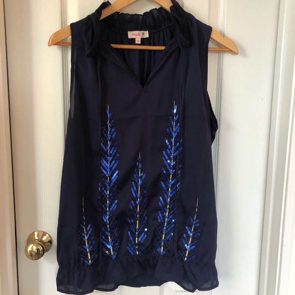 Sleeveless shirt with ruffle hem, sequin details
